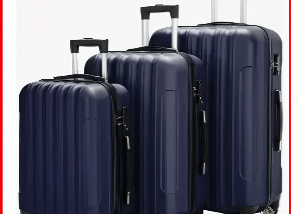 Three navy blue hard-shell suitcases.